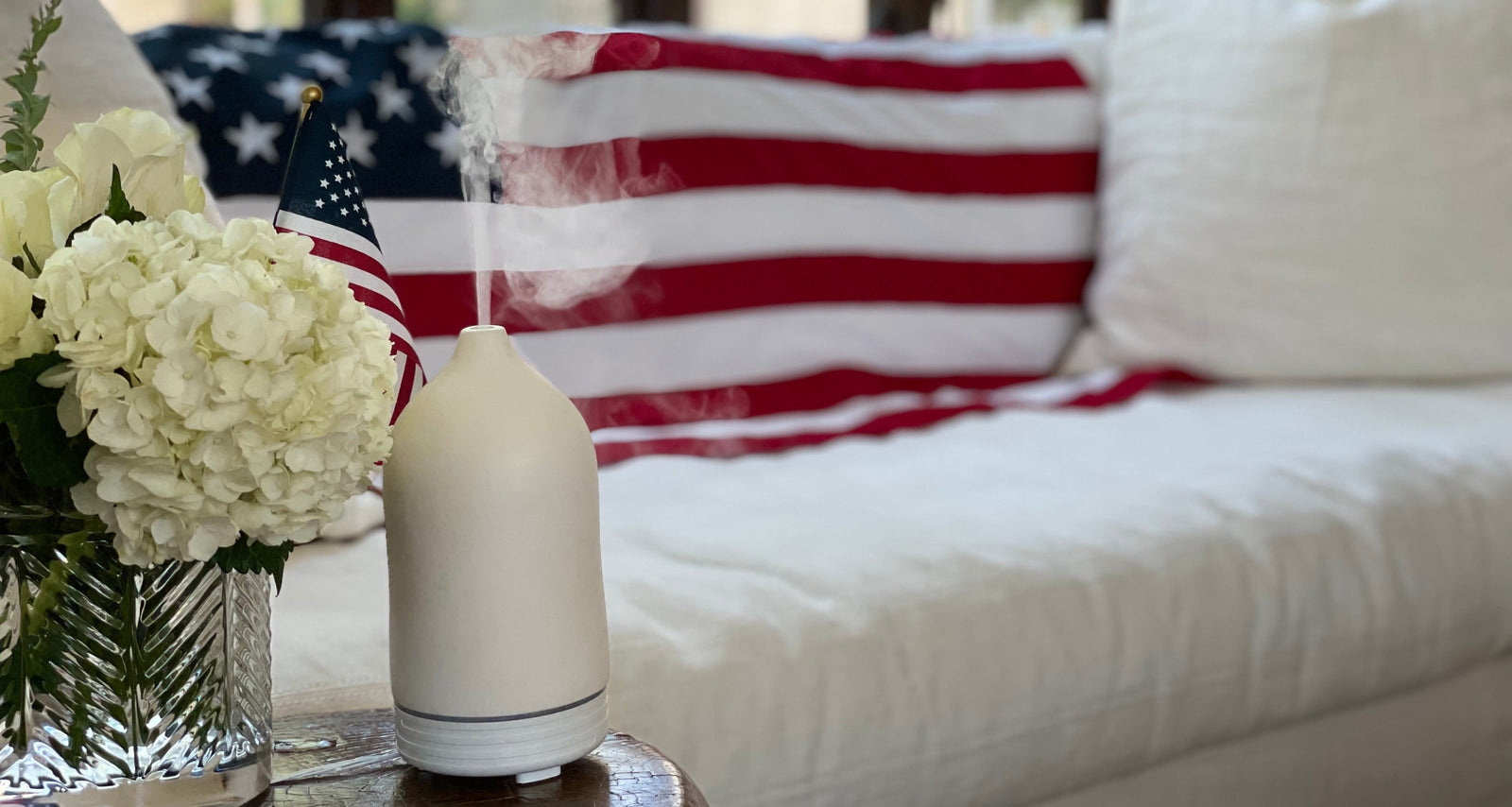 Campo White Ceramic diffuser with essential oil mist and USA flag. 