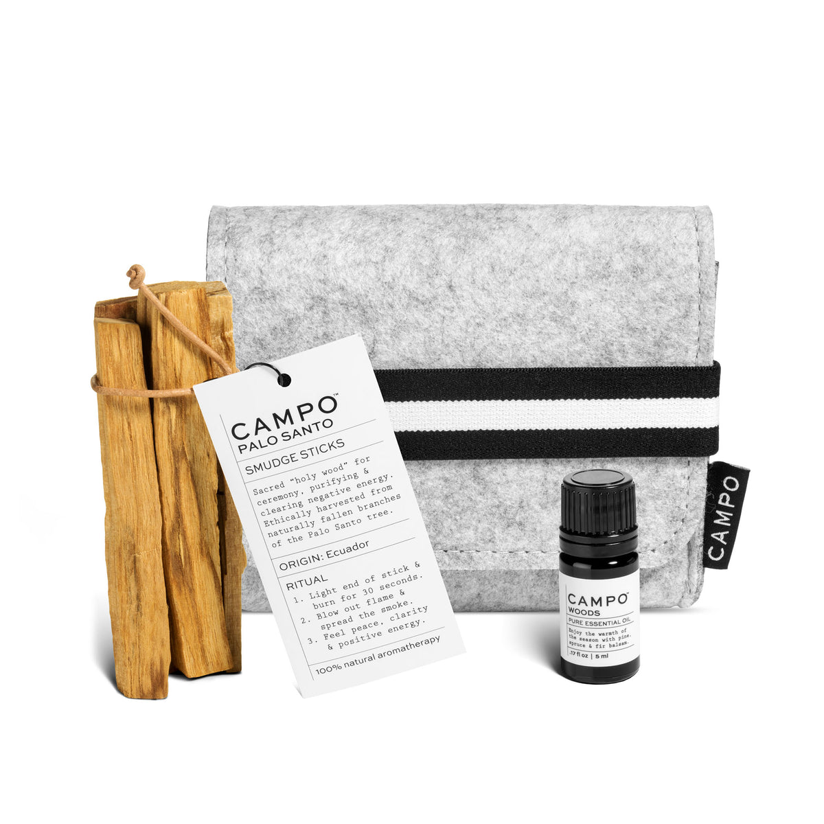 Campo Beauty Lift the spirits of any space or mood with this WOOD Kit.   Includes: WOODS PURE ESSENTIAL OIL 5ml + PALO SANTO + Grey Felt Bag.  WOODS: Transport &amp; Transform yourself with this 100% pure essential oil blend of Pine Scotch, Siberian Fir, Balsam Fir, Black Spruce, and Bergamot. A distinctive scent inspired by the smell of a fresh-cut tree and a walk in the woods. A perfect complement to CAMPO essential oil diffusers. Add a few drops to your shower for the ultimate indoor adventure.